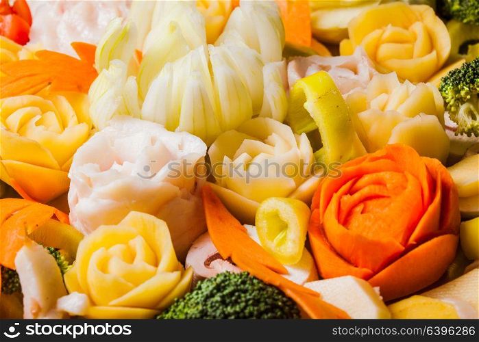 Carved vegetables for baking, original creative food. Carved vegetables for baking