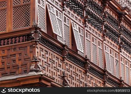 carved wooden balcony of the old house. carved wooden balcony