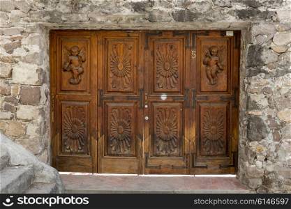 Carved wooden entrance doorway of a building, Zona Centro, San Miguel de Allende, Guanajuato, Mexico