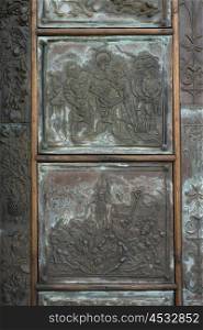 Carving detail of metal door, Praiano, Amalfi Coast, Salerno, Campania, Italy