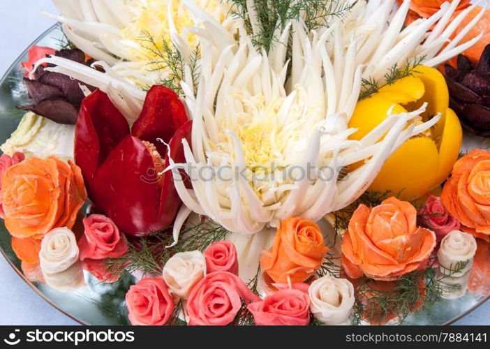 Carving is the art of cutting vegetables and fruits