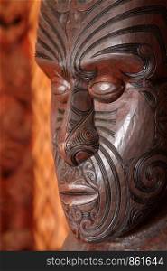 Carving of the Maori shows face of wood