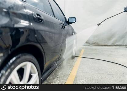 Carwash service, cleaning the car. Auto detailing, high pressure washing on special station