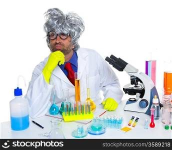 Carzy pensive nerd scientist at chemical laboratory thinking with microscope