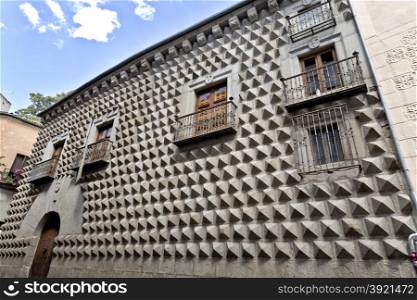 Casa de los Picos with its facade covered by granite blocks carved into diamond-shapes in Segovia, Spain.