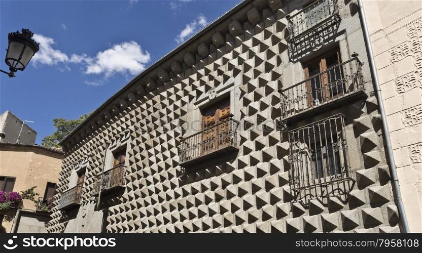 Casa de los Picos with its facade covered by granite blocks carved into diamond-shapes in Segovia, Spain.