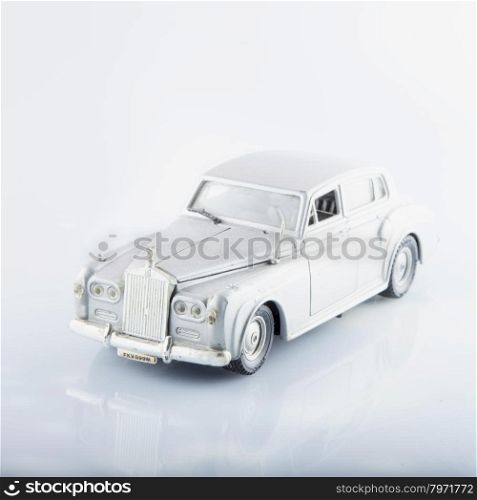 CASALE MONFERRATO, AUGUST 11, 2015: Rolls Royce Silver Cloud toy car model, over reflectig surface, made by Italian factory Polystil, scale 1:30