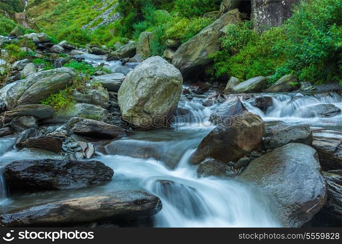 Cascade falls over mossy rocks