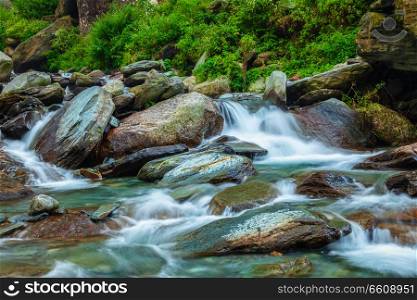Cascade of Bhagsu (Bhagsunag, Bagsu) waterfall. Bhagsu (Bagsu), Himachal Pradesh, India. Polarizer filter used. Bhagsu waterfall. Bhagsu, Himachal Pradesh, India