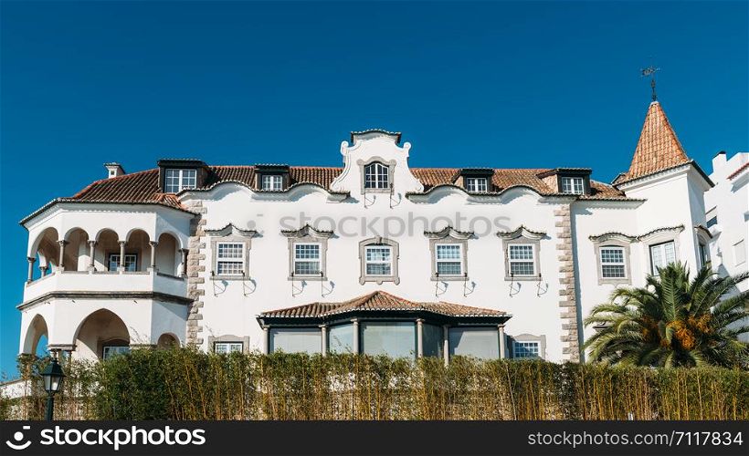 Cascais, Portugal - August 30, 2019: Facade of whitewashed historic villa in the historic centre of Cascais, Portugal. Facade of whitewashed historic villa in the historic centre of Cascais, Portugal