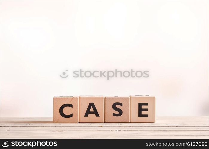 Case sign on wooden cubes at a indoor table