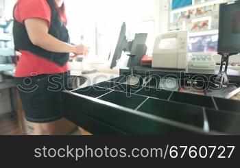 Cash drawer at gas station checkout