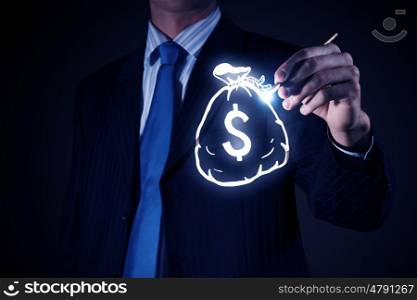 Cash flow. Chest view of businessman drawing money bag on screen