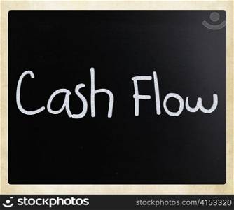 ""Cash flow" handwritten with white chalk on a blackboard"