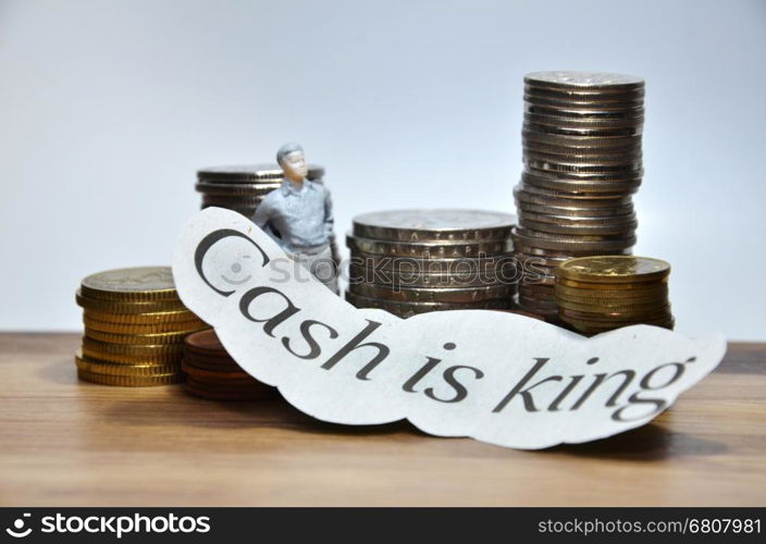 Cash is King words with many coins