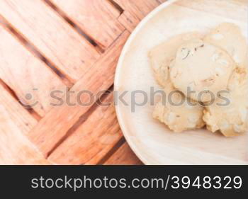 Cashew cookies on wooden plate, stock photo