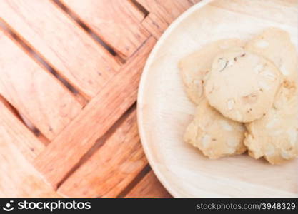 Cashew cookies on wooden plate, stock photo