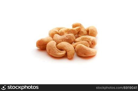 Cashew nuts heap on white background