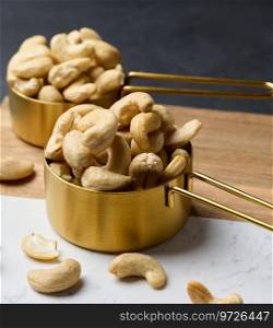 Cashews in a metal bowl on the table