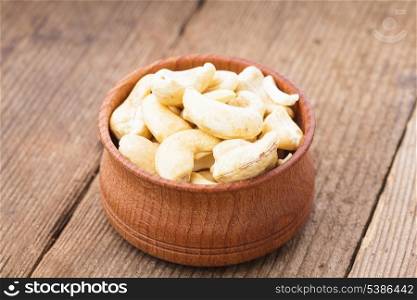 cashews in a wooden bowl on the table