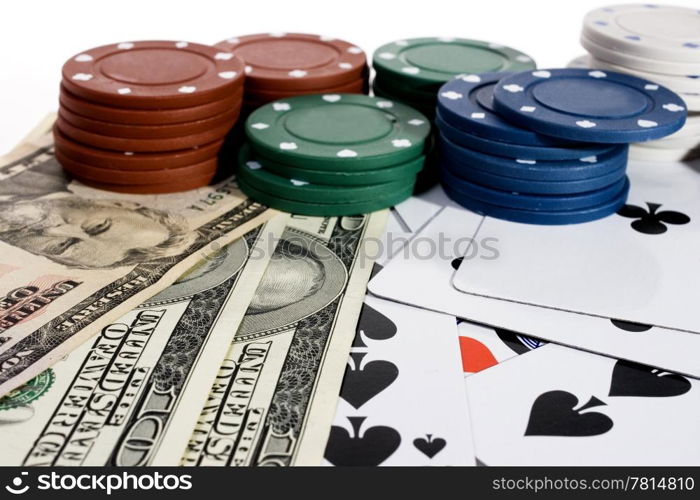 Casino chips and American money on a green table