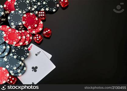 Casino chips and playing cards on dark reflective background.. Casino chips and playing cards on dark reflective background