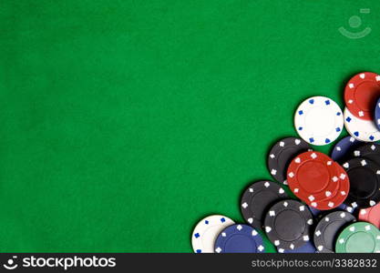 Casino chips on a green felt - background image