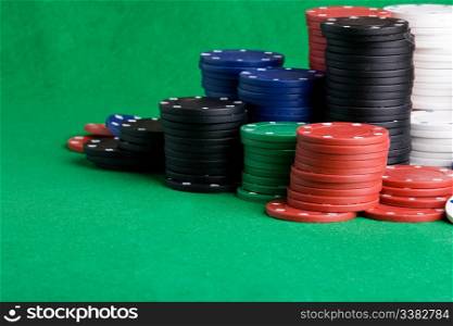 Casino Chips on green felt background