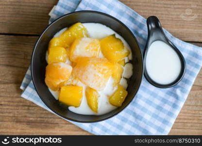 cassava food on the table food, sweet dessert made of boiled cassava, sugar and coconut milik - Thai food