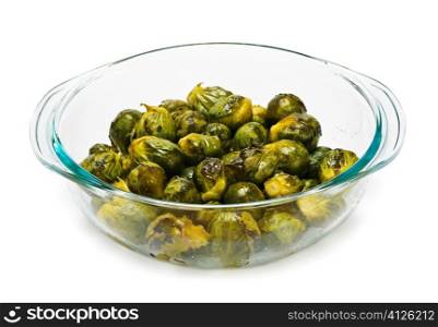 Casserole dish of roasted cooked green brussels sprouts