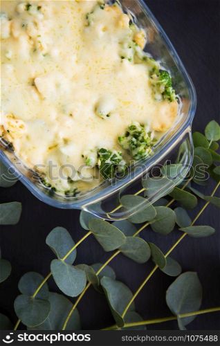 casserole with broccoli, cheese and cream, close-up. casserole with broccoli, cheese and cream, close-up.