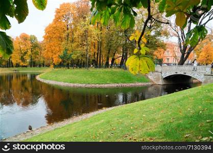 Cast iron bridge in Mikhailovsky Park,.Autumn landscape, St. Petersburg Mikhailovsky castle. Cast iron bridge in Mikhailovsky Park,.Autumn landscape, St. Petersburg, Mikhailovsky castle.