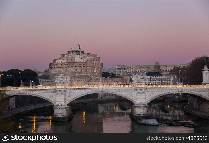 Castel Sant'Angelo in Rome with bridge at sunset.