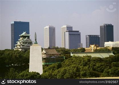 Castle and skyscrapers in a city, Osaka Castle, Osaka, Japan