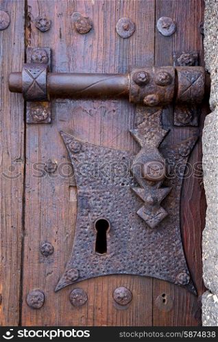 castle lock spain knocker lanzarote abstract door wood in the red brown &#xA;