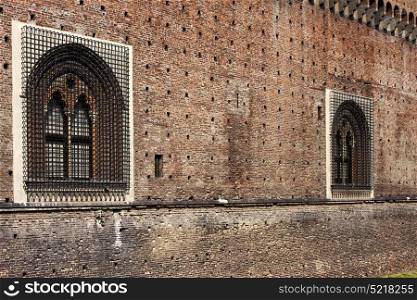 castle old brown brick and window in the grass of castle sforzesco milan