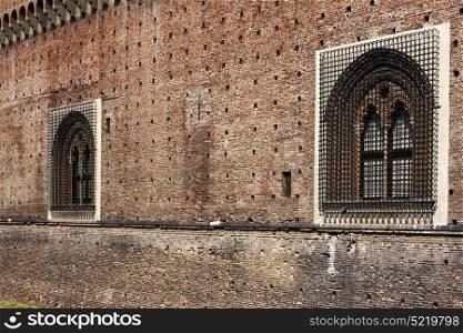 castle old brown brick and window in the grass of castle sforzesco milan
