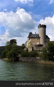 castle standing on a lake coast