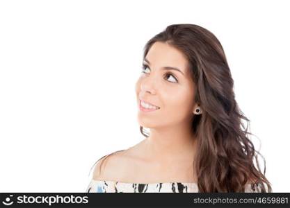 Casual brunette girl looking up isolated on a white background