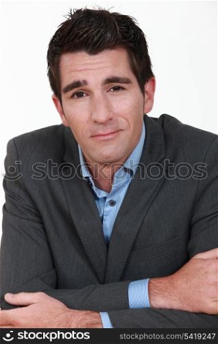 Casual businessman with his arms folded