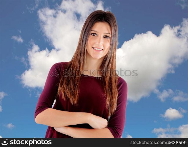 Casual cool young woman with a blue sky of background