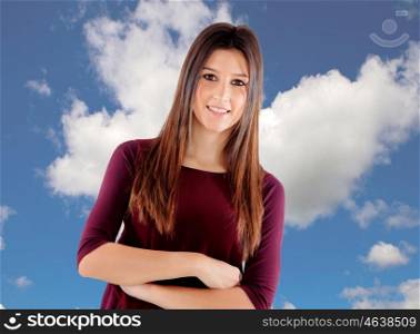 Casual cool young woman with a blue sky of background
