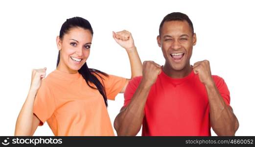 Casual couple with red and orange t-shirt celebrating something isolated on a white background
