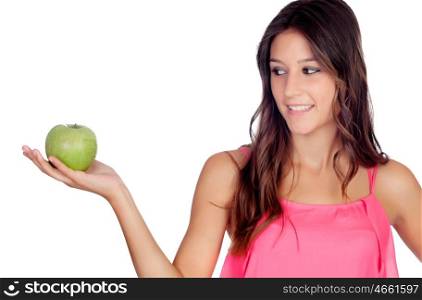 Casual girl in pink with a green apple isolated on a white background