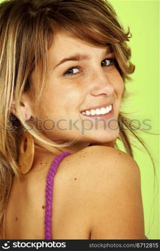 casual girl smiling over a green background