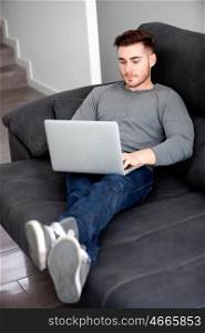 Casual handsome men with the laptop at home