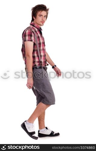 Casual handsome young guy in walking posture isolated on white background