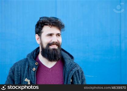 Casual hipster man with long beard at the street