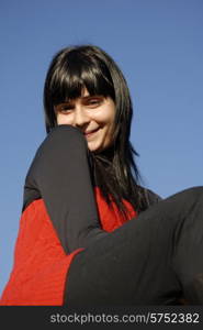 casual latin girl outdoors with the sky in the background