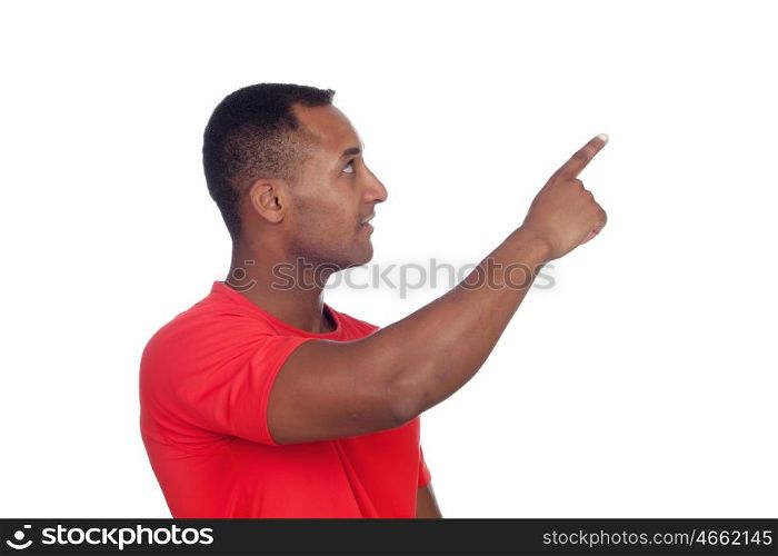Casual latin man indicating something isolated on a white background